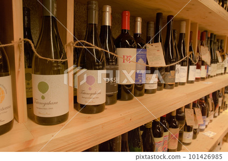 Wines from around the world displayed in a wine shop 01 101426985