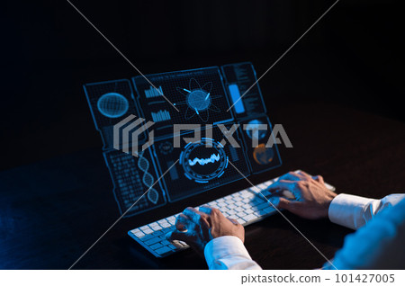 Caucasian man sits in the dark in front of a virtual menu. Close-up of male hands on the keyboard. Caucasian man sits in the dark in front of a virtual menu. Close-up of male hands on the keyboard. 101427005