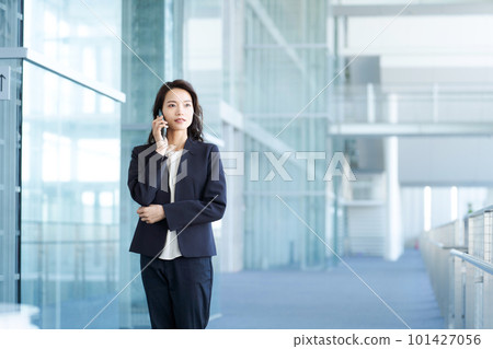 Business woman calling with a smartphone 101427056