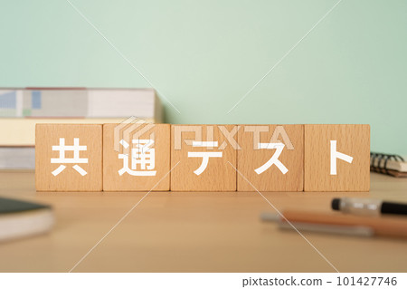 A desk with a block written as a common test A desk with a block written as a common test 101427746