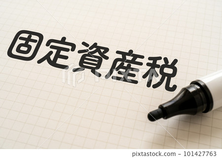 A notebook and a marker that says Property Tax A notebook and a marker that says Property Tax 101427763