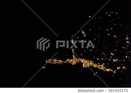 Orange, lemon juice or oil lubricant splash, liquid gold yellow drink drops. Fruit beverage water elements in line form . Fresh splashing and flowing jets, black background isolated freeze motion Orange, lemon juice or oil lubricant splash, liquid gold yellow drink drops. Fruit beverage water elements in line form . Fresh splashing and flowing jets, black background isolated freeze motion 101428173