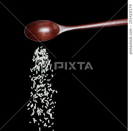 Japanese Rice fall, white grain rices pouring down abstract cloud fly from spoon. Beautiful complete seed rice in air, food object design. Selective focus freeze shot Black background isolated 101428174
