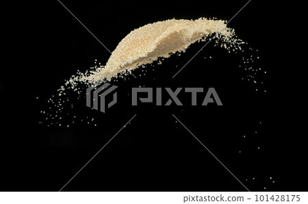 Brown Sugar flying explosion, brown grain sugar explode abstract cloud fly. Beautiful complete seed sugarcane splash in air, food object design. Selective focus freeze shot Black background isolated 101428175