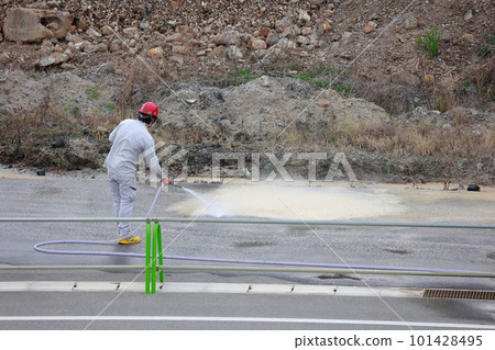 Workers washing roads with water Workers washing roads with water 101428495