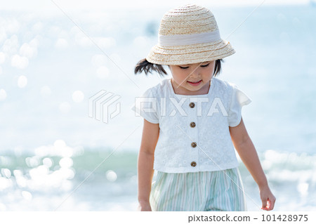A child walking along the beach 101428975