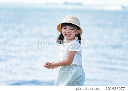 A child walking along the beach 101428977