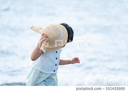 A child walking along the beach 101428980