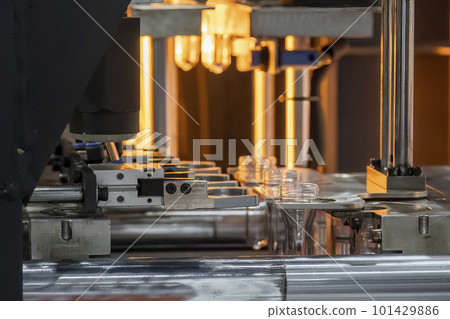 The drinking water bottle manufacturing process by blow mold machine. The drinking water bottle manufacturing process by blow mold machine. 101429886