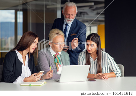 Mature businessman leader mentor talking to diverse colleagues team listening to caucasian ceo. Mature businessman leader mentor talking to diverse colleagues team listening to caucasian ceo. 101431612