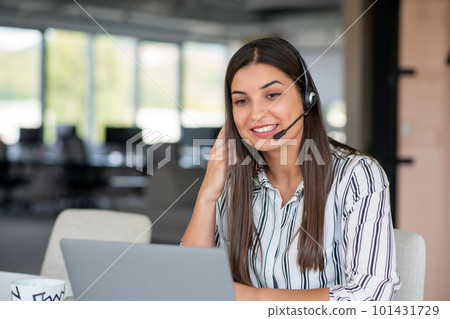 Brunette Lady Video Calling On Laptop Wearing Headphones Smiling And Waving Hand To Webcam Communicating Online Brunette Lady Video Calling On Laptop Wearing Headphones Smiling And Waving Hand To Webcam Communicating Online 101431729