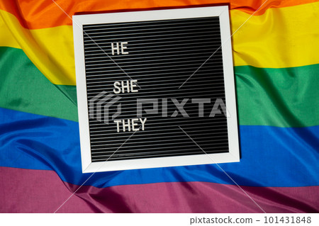 HE SHE THEY text Neo pronouns concept on Rainbow flag background gender pronouns. Non-binary people rights transgenders. Lgbtq community support assume my gender tolerance equal rights 101431848