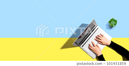 Person using a laptop computer 101431859