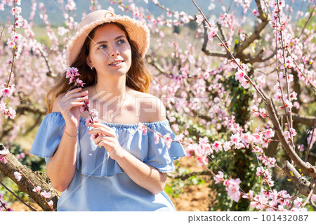 Girl in the spring garden peach in blue dress Girl in the spring garden peach in blue dress 101432087