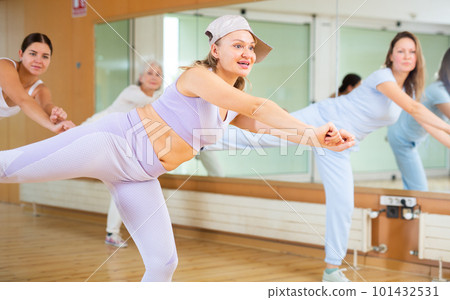 Dynamic middle-aged woman dancing hip-hop Dynamic middle-aged woman dancing hip-hop 101432531