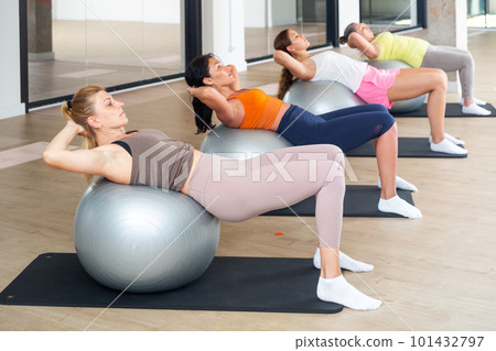 Sports women is training cross fitness with pilates balls 101432797