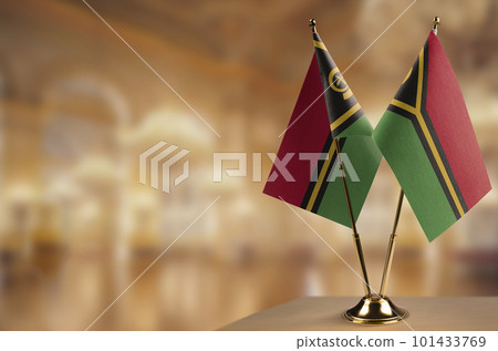 Small flags of the Vanuatu on an abstract blurry background 101433769
