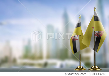 Small flags of the Brunei on an abstract blurry background Small flags of the Brunei on an abstract blurry background 101433788