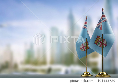 Small flags of the Fiji on an abstract blurry background Small flags of the Fiji on an abstract blurry background 101433789