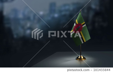 Small flags of the Dominica on an abstract blurry background Small flags of the Dominica on an abstract blurry background 101433844
