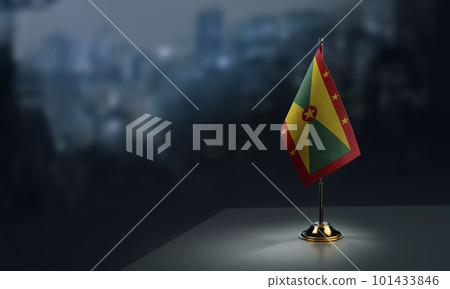 Small flags of the Grenada on an abstract blurry background 101433846