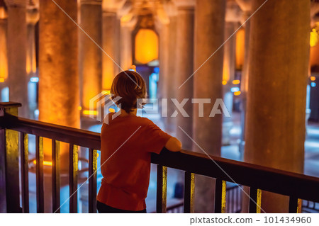 boy tourist enjoying Beautiful cistern in Istanbul. Cistern - underground water reservoir build in 6th century, Istanbul, Turkey, Turkiye boy tourist enjoying Beautiful cistern in Istanbul. Cistern - underground water reservoir build in 6th century, Istanbul, Turkey, Turkiye 101434960