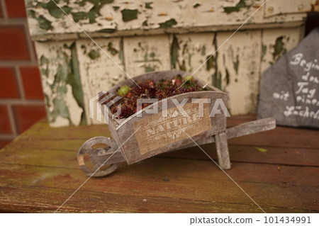 Old wheelbarrow flowerbed colorfull flowers garden decor Old wheelbarrow flowerbed colorfull flowers garden decor 101434991