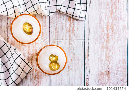Spicy cocktail with margarita, egg white foam, tagine and jalapeno peppers in glasses top view 101435554
