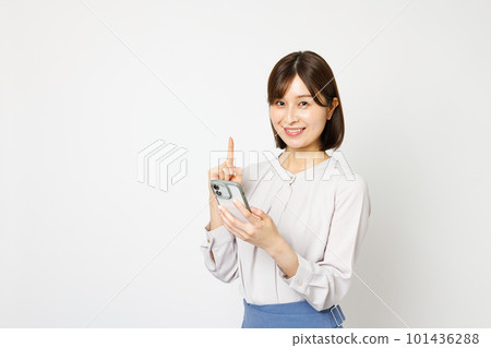 Woman operating a smartphone 101436288