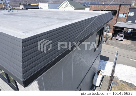 Aerial view of dented eaves due to snow damage (before and after housing renovation) 101436622