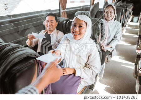 Bus passengers give tickets to the bus driver Bus passengers give tickets to the bus driver 101438265