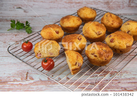 Savory muffin with ham and cheese on blue background 101438342