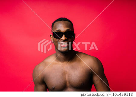 Like what you see. A handsome and muscular young man posing in the studio. Like what you see. A handsome and muscular young man posing in the studio. 101439118