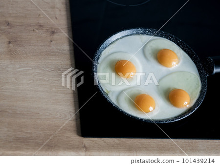 Four egg in a frying pan Four egg in a frying pan 101439214