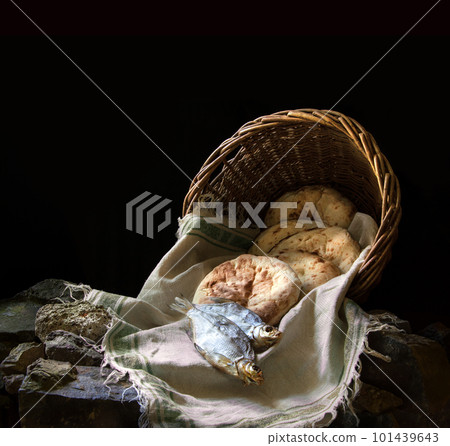 Five loaves and two fish in a basket Five loaves and two fish in a basket 101439643