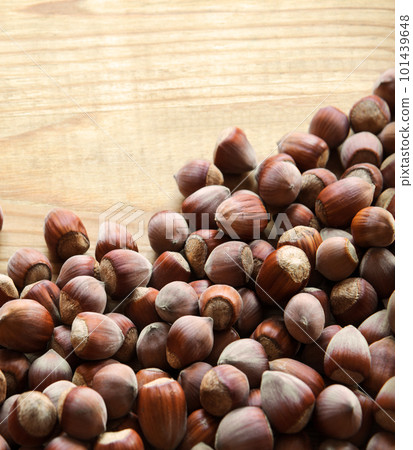 Hazelnuts on a wooden table Hazelnuts on a wooden table 101439648