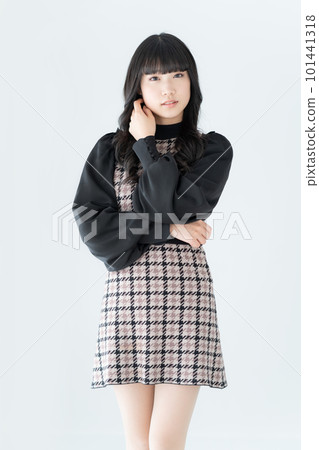 Portrait of a Z-generation girl on a white background vertical position 101441318
