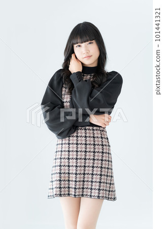 Portrait of a Z-generation girl on a white background vertical position Portrait of a Z-generation girl on a white background vertical position 101441321