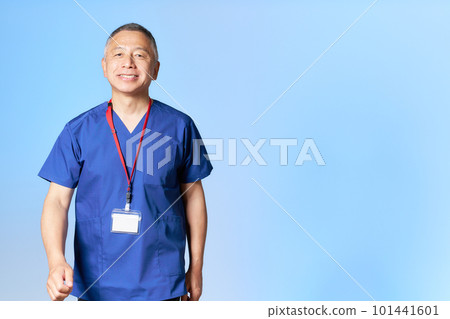 Senior healthcare workers wearing blue scrubs Senior healthcare workers wearing blue scrubs 101441601