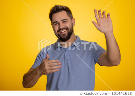Man showing inviting gesture with hands, ask to join, beckoning to coming, gesturing hello goodbye Man showing inviting gesture with hands, ask to join, beckoning to coming, gesturing hello goodbye 101441658