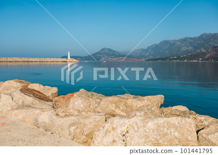 Small lighthouse in mediterranean sea in Montenegro, focused on stone 101441795