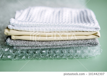 Recycling Fibers in the Textile Industry. Sustainable recycled cotton fiber. Many napkins fabrics made of recycled polyester synthetic fabric and bubble wrap Recycling Fibers in the Textile Industry. Sustainable recycled cotton fiber. Many napkins fabrics made of recycled polyester synthetic fabric and bubble wrap 101442307