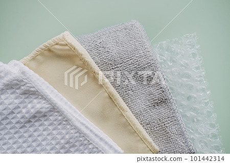 Recycling Fibers in the Textile Industry. Sustainable recycled cotton fiber. Many napkins fabrics made of recycled polyester synthetic fabric and bubble wrap 101442314