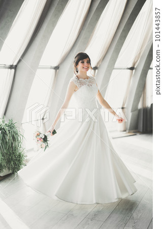 Beautiful fashion bride in wedding dress posing Beautiful fashion bride in wedding dress posing 101443857