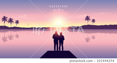 couple in love by the ocean at sunset with mountain and palm tree view 101444254