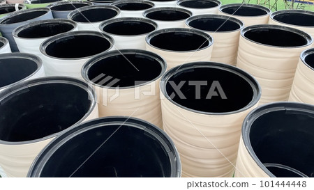 Close-up of empty flower pots in a store or greenhouse. Colorful pots for plants. Gardening and landscape design concept Close-up of empty flower pots in a store or greenhouse. Colorful pots for plants. Gardening and landscape design concept 101444448