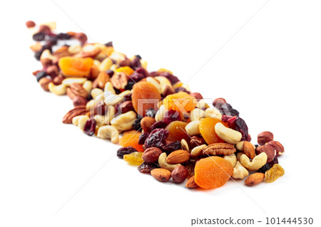 Mix of nuts and dried fruits isolated on a white background. Mix of nuts and dried fruits isolated on a white background. 101444530