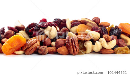 Mix of nuts and dried fruits isolated on a white background. Mix of nuts and dried fruits isolated on a white background. 101444531