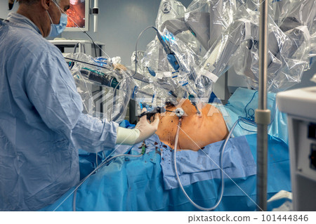 Surgical system with minimally invasive robot in a hospital. Robotic technological equipment, manipulator surgeon in a futuristic operating room. Medical innovation 3D endoscopy for robotic surgery in 101444846