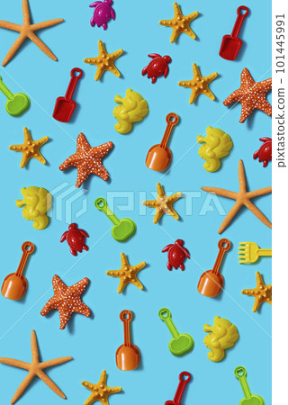 starfish and beach toys on a blue background starfish and beach toys on a blue background 101445991